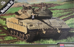 Model tank kit of Merkava Mk. IV on a grassy field with Academy branding.